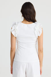A model wearing the Frills Tank in colour White (White), from the back