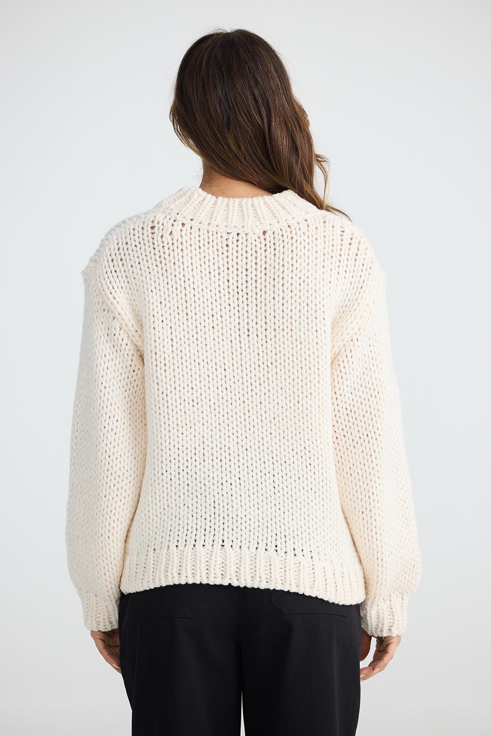 A model wearing the Heart On My Sleeve Knit in colour Offwhite (White), from the back