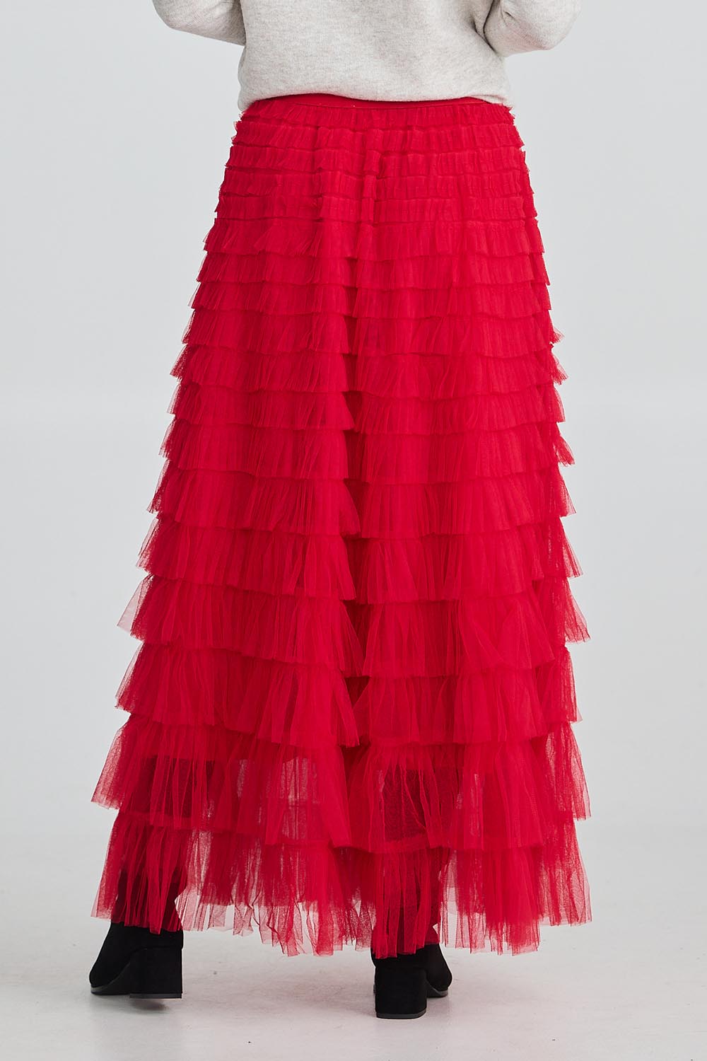 A model wearing the Chance Skirt in colour Berryred (Red), from the back