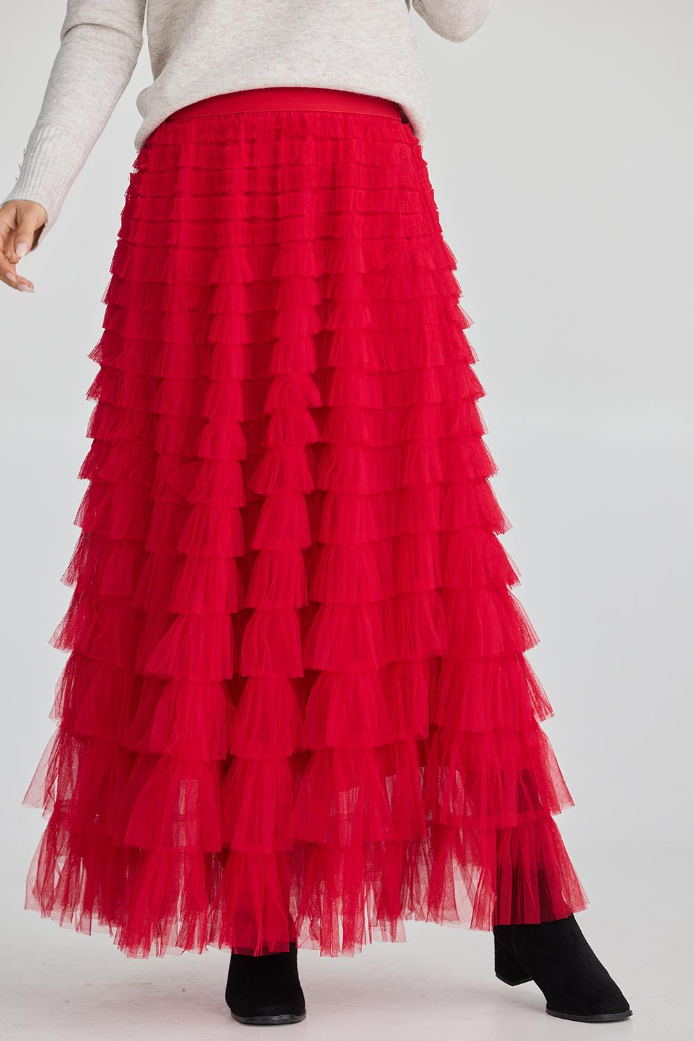 A model wearing the Chance Skirt in colour Berryred (Red), from the front, cropped image