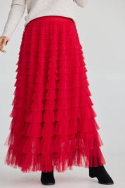 A model wearing the Chance Skirt in colour Berryred (Red), from the front, cropped image
