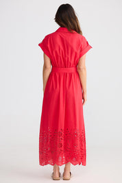A model wearing the Versailles Cotton Dress in colour Chilli (Red), from the back