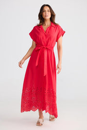 A model wearing the Versailles Cotton Dress in colour Chilli (Red), from the front, showing the whole outfit
