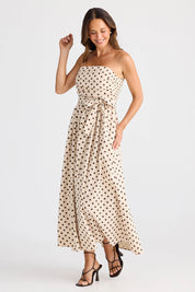 A model wearing the Avalon Cotton Maxi Dress in colour Chocpolka, from the front, showing the whole outfit