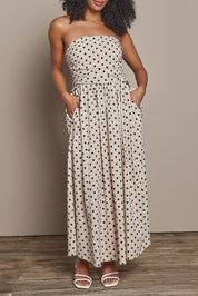 Model Ziara wearing size S of the Avalon Cotton Maxi Dress in colour Chocpolka, from the front, cropped image