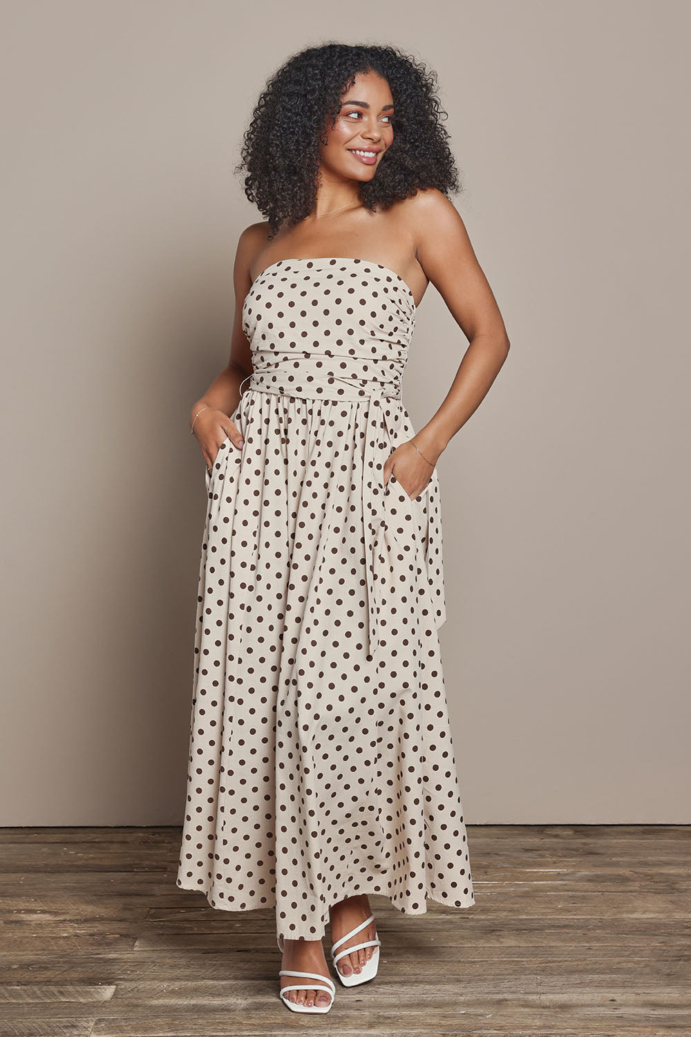 Model Ziara wearing size S of the Avalon Cotton Maxi Dress in colour Chocpolka, from the front, showing the whole outfit