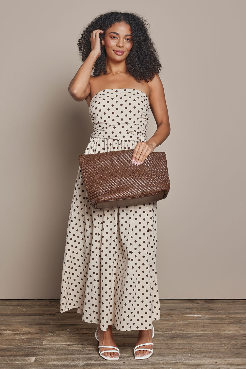 Model Ziara wearing size S of the Avalon Cotton Maxi Dress in colour Chocpolka, from the front, showing the whole outfit