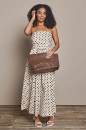 Model Ziara wearing size S of the Avalon Cotton Maxi Dress in colour Chocpolka, from the front, showing the whole outfit