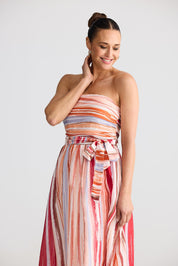 A model wearing the Avalon Dress in colour Painterly, from the front, cropped image