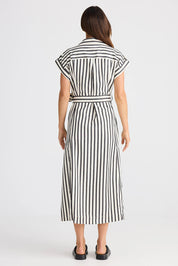 A model wearing the Portia Dress in colour Blackstrip, from the back