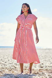 Model Eshan wearing size 10 of the Portia Dress - Cherrystripe in colour Cherrystripe, from the front