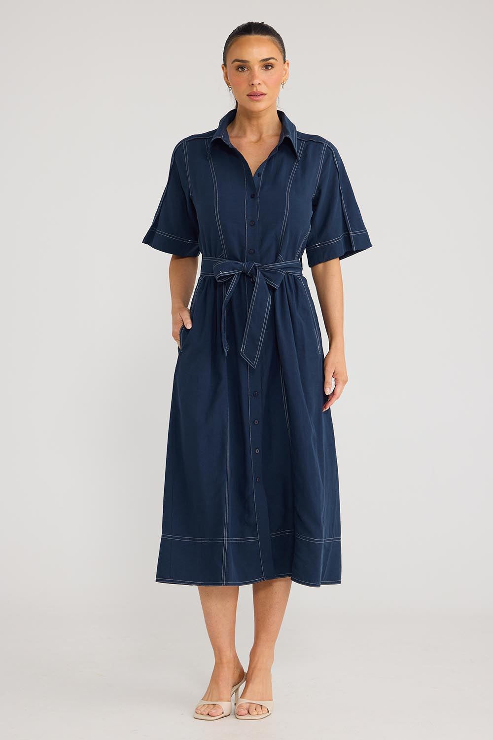 Model Genericm wearing size sample of the Leo Dress - Navy in colour Navy, from the front