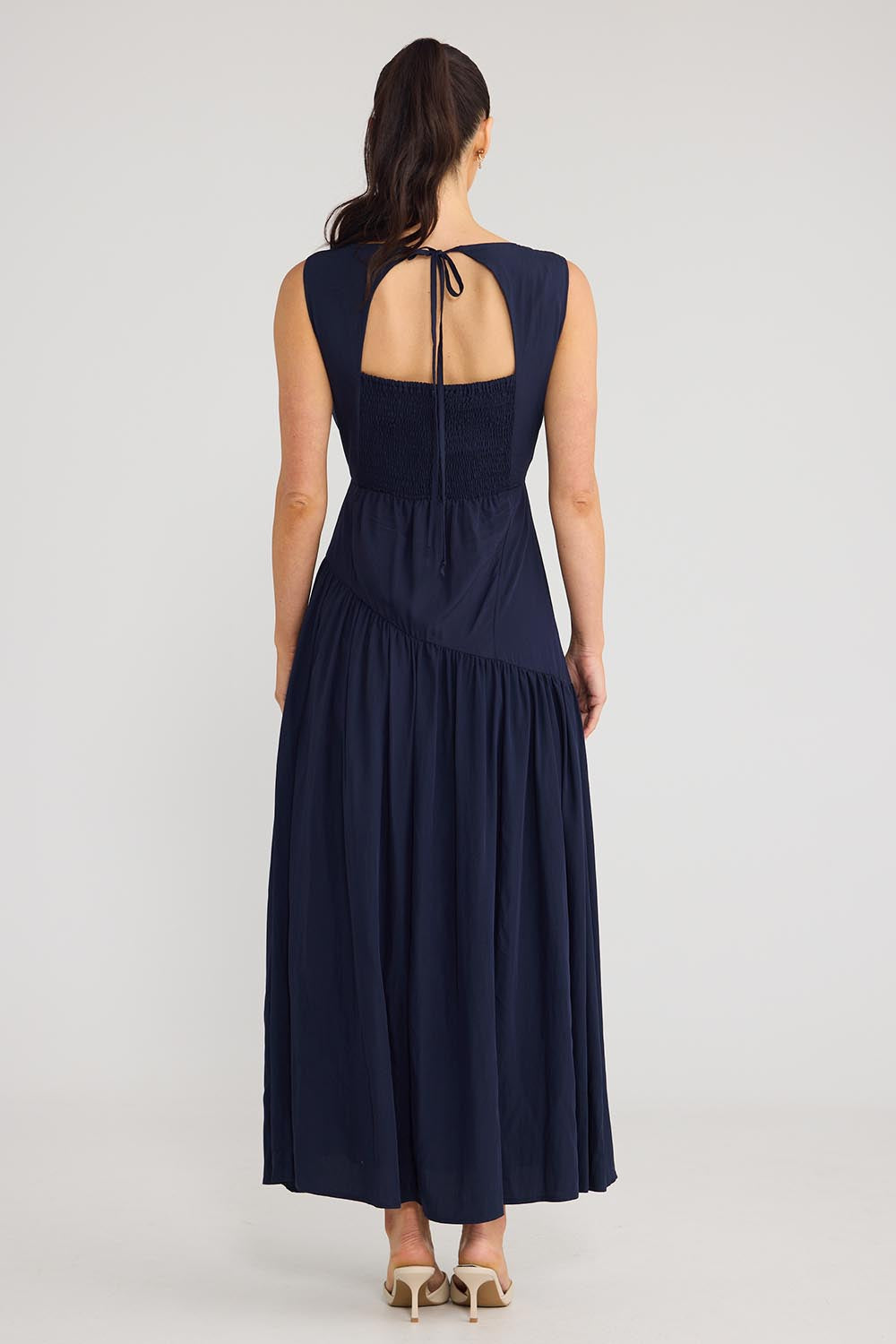 Model Genericm wearing size sample of the Tamara Dress - Inknavy in colour Inknavy, from the front