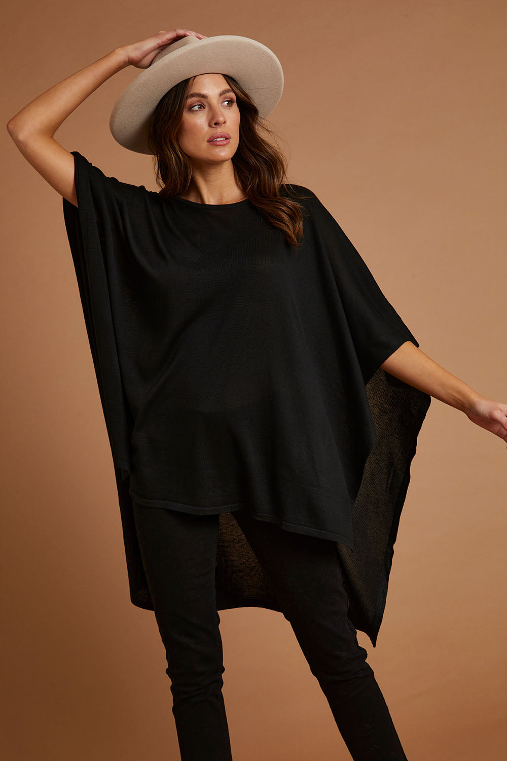 Model Madeline wearing size OneSize of the Vaasa Top in colour Black (Black), from the front, showing the whole outfit
