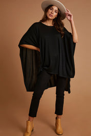 Model Madeline wearing size OneSize of the Vaasa Top in colour Black (Black), from the front, showing the whole outfit