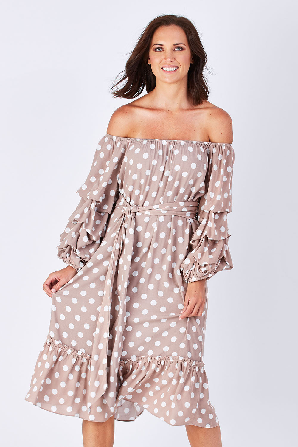 Model Perrie wearing size S-M of the Saloon Dress in colour BlushDot (Pink), from the front, cropped image