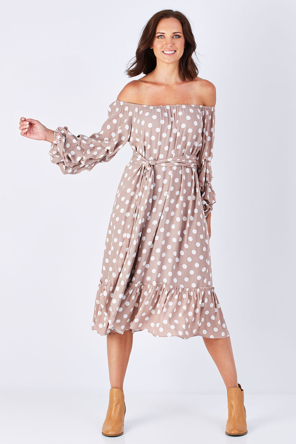 Model Perrie wearing size S-M of the Saloon Dress in colour BlushDot (Pink), from the front, showing the whole outfit