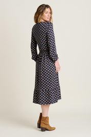 A model wearing the Annie Faux Wrap Cotton Dress in colour Navy (Blue), from the back
