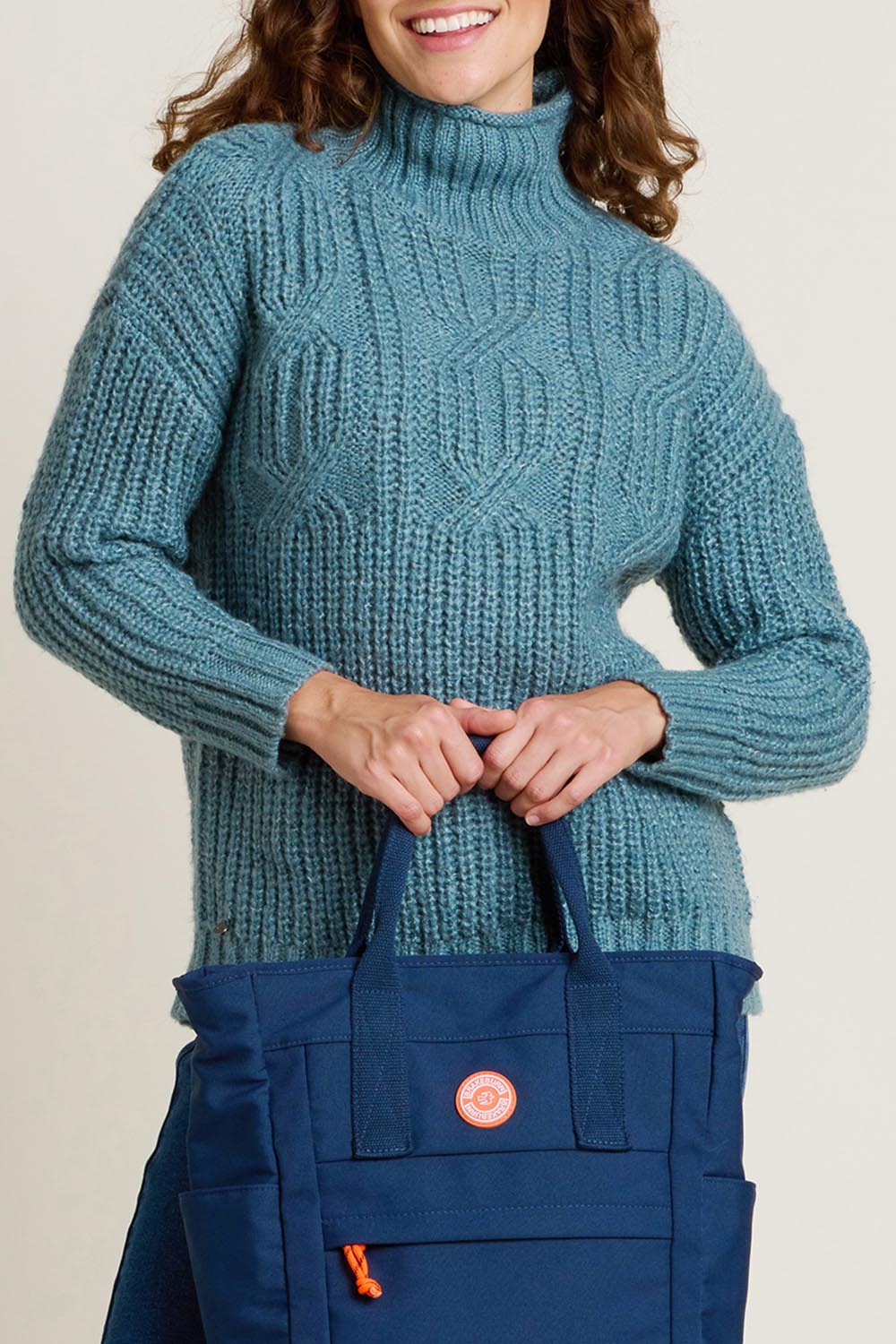 A model wearing the Cable Knitted Roll Neck Jumper in colour Blue (Blue), from the front, cropped image