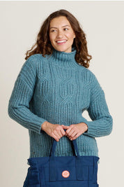 A model wearing the Cable Knitted Roll Neck Jumper in colour Blue (Blue), from the front, cropped image