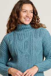 A model wearing the Cable Knitted Roll Neck Jumper in colour Blue (Blue), from the front, cropped image