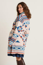 A model wearing the Geo Belted Wool Blend Knitted Cardigan in colour Multi, from the back