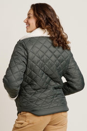 A model wearing the Fortunes Reversible Jacket in colour Multi (Green), from the back