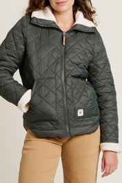 A model wearing the Fortunes Reversible Jacket in colour Multi (Green), from the front, cropped image
