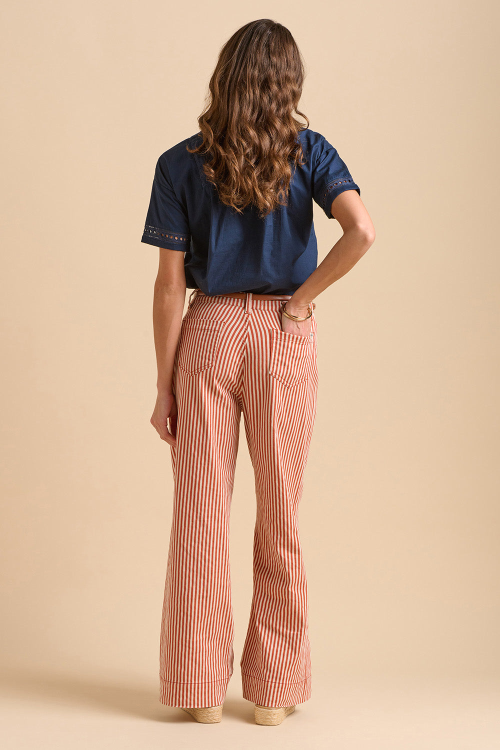 A model wearing the Stripe Straight Leg Jeans in colour Redwhite, from the back