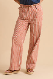 A model wearing the Stripe Straight Leg Jeans in colour Redwhite, from the front, cropped image