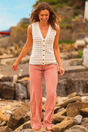 A model wearing the Stripe Straight Leg Jeans in colour Redwhite, from the front, showing the whole outfit