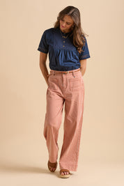 A model wearing the Stripe Straight Leg Jeans in colour Redwhite, from the front, showing the whole outfit