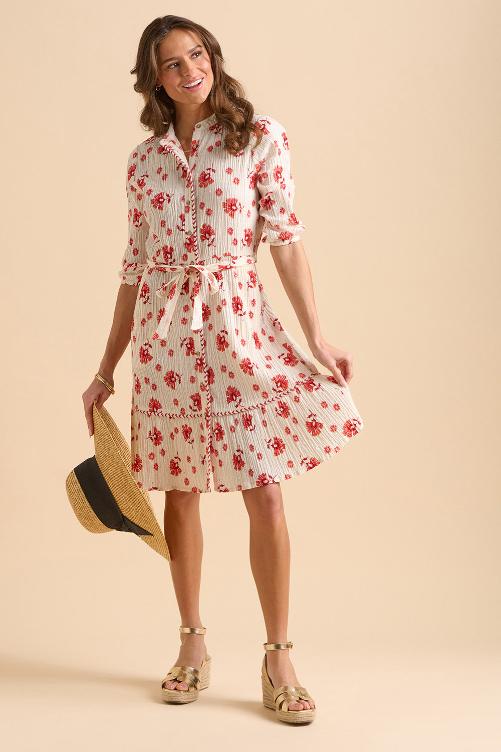 A model wearing the Fan Floral Cotton Knee Length Dress in colour Whitered, from the front, showing the whole outfit