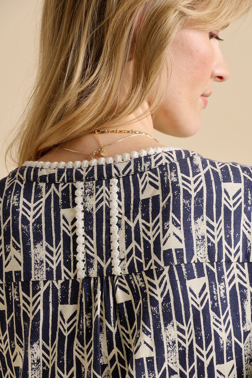 A model wearing the Arrows Cotton Midi Dress in colour Navy (Blue), from the back
