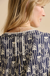 A model wearing the Arrows Cotton Midi Dress in colour Navy (Blue), from the back