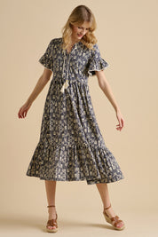 A model wearing the Arrows Cotton Midi Dress in colour Navy (Blue), from the front, showing the whole outfit