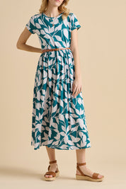 A model wearing the Woodland Leaves Maxi Cotton Jersey Dress in colour Multi (Blue), from the front, cropped image