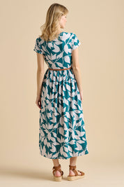 A model wearing the Woodland Leaves Maxi Cotton Jersey Dress in colour Multi (Blue), from the front, showing the whole outfit