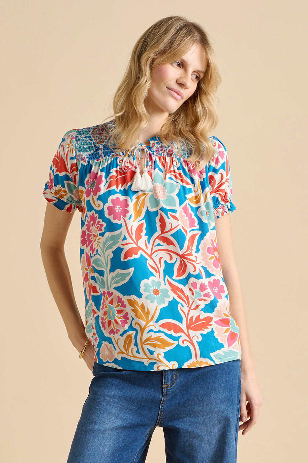 A model wearing the Full Bloom Blouse in colour Multi (Blue), from the front, cropped image