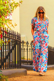 A model wearing the Full Bloom Trouser in colour Multi, from the front, showing the whole outfit