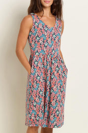 A model wearing the Millie Sleeveless Dress in colour Multi (Blue), from the front, cropped image