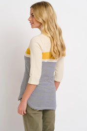 A model wearing the Beach Stripe Tee in colour Multi (Blue), from the back