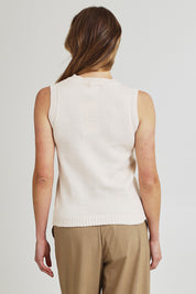 Model Olivia wearing the Knit Vest in colour Beige, from the back