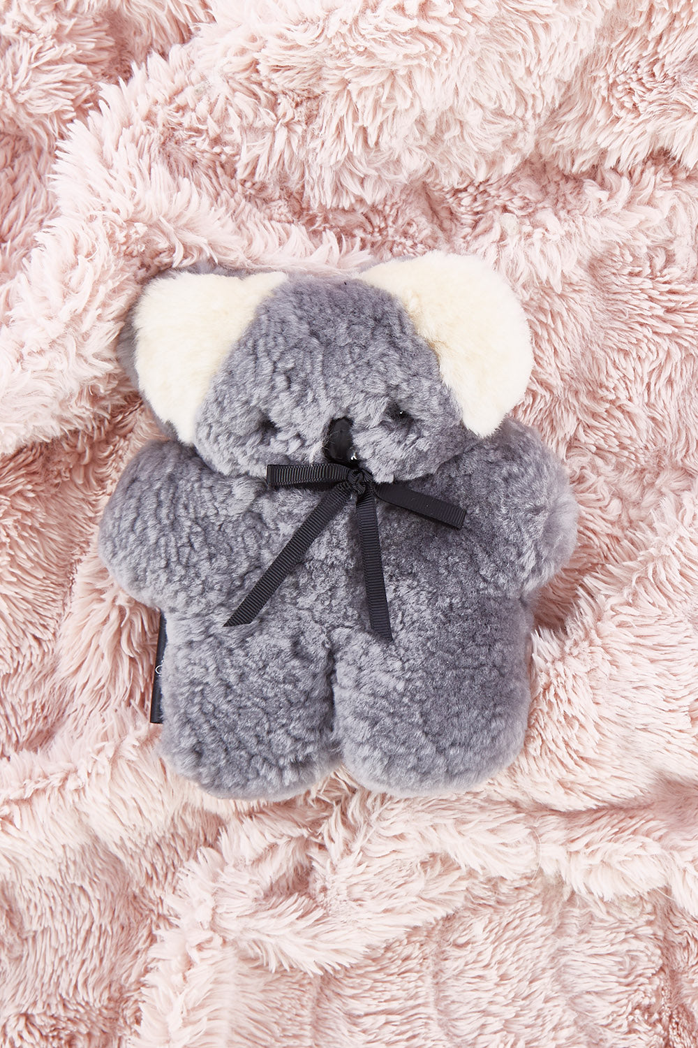 A model wearing the Baby Flatout Bear in colour Koala (Blue), from the front, showing the whole outfit