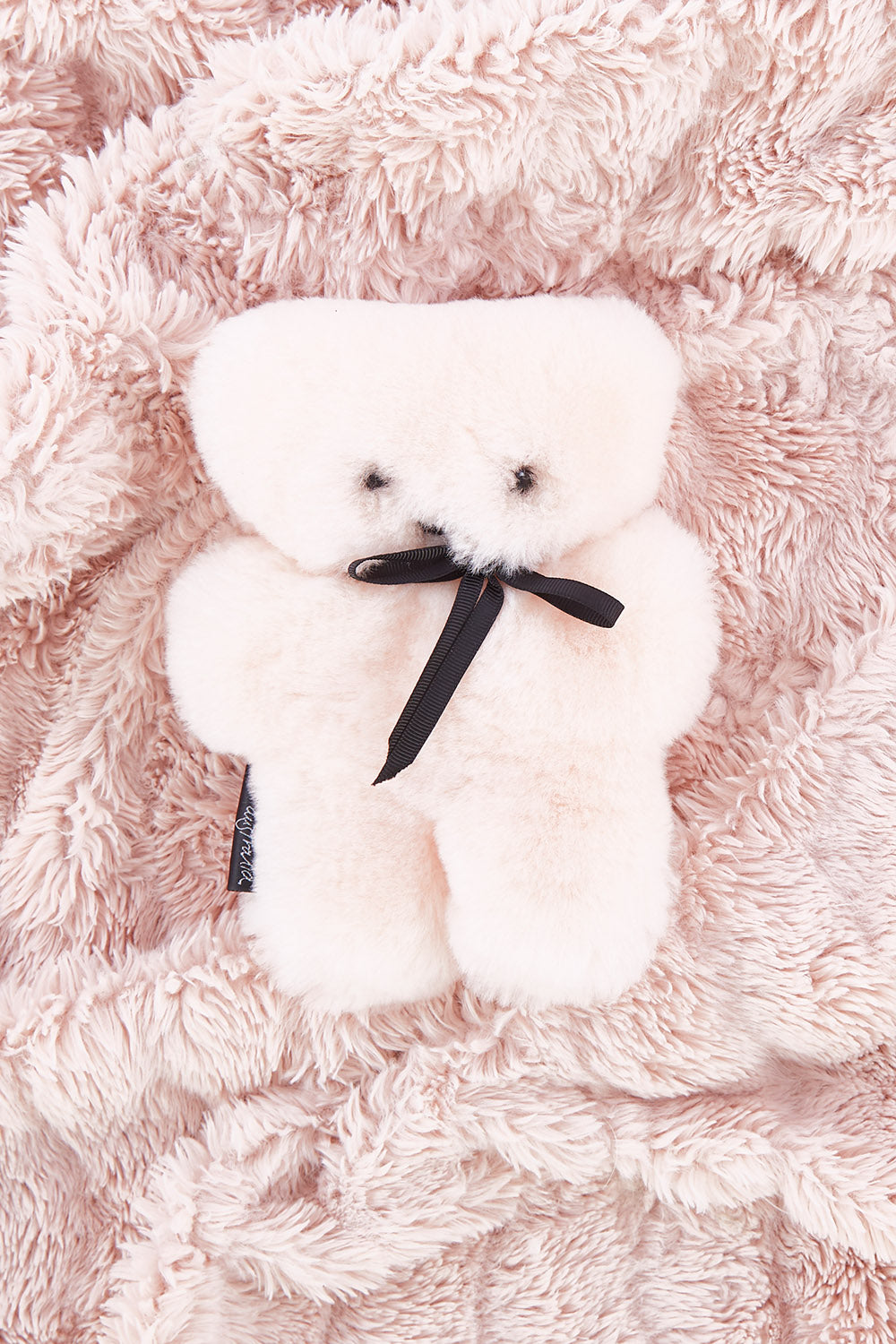 A model wearing the Baby Flatout Bear in colour Rosie (Pink), from the front, showing the whole outfit