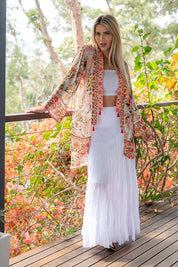 A model wearing the Rouge Bloom Kimono in colour Rouge, from the front, showing the whole outfit