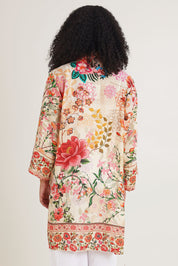 Model Ziara wearing the Rouge Bloom Kimono in colour Rouge, from the back