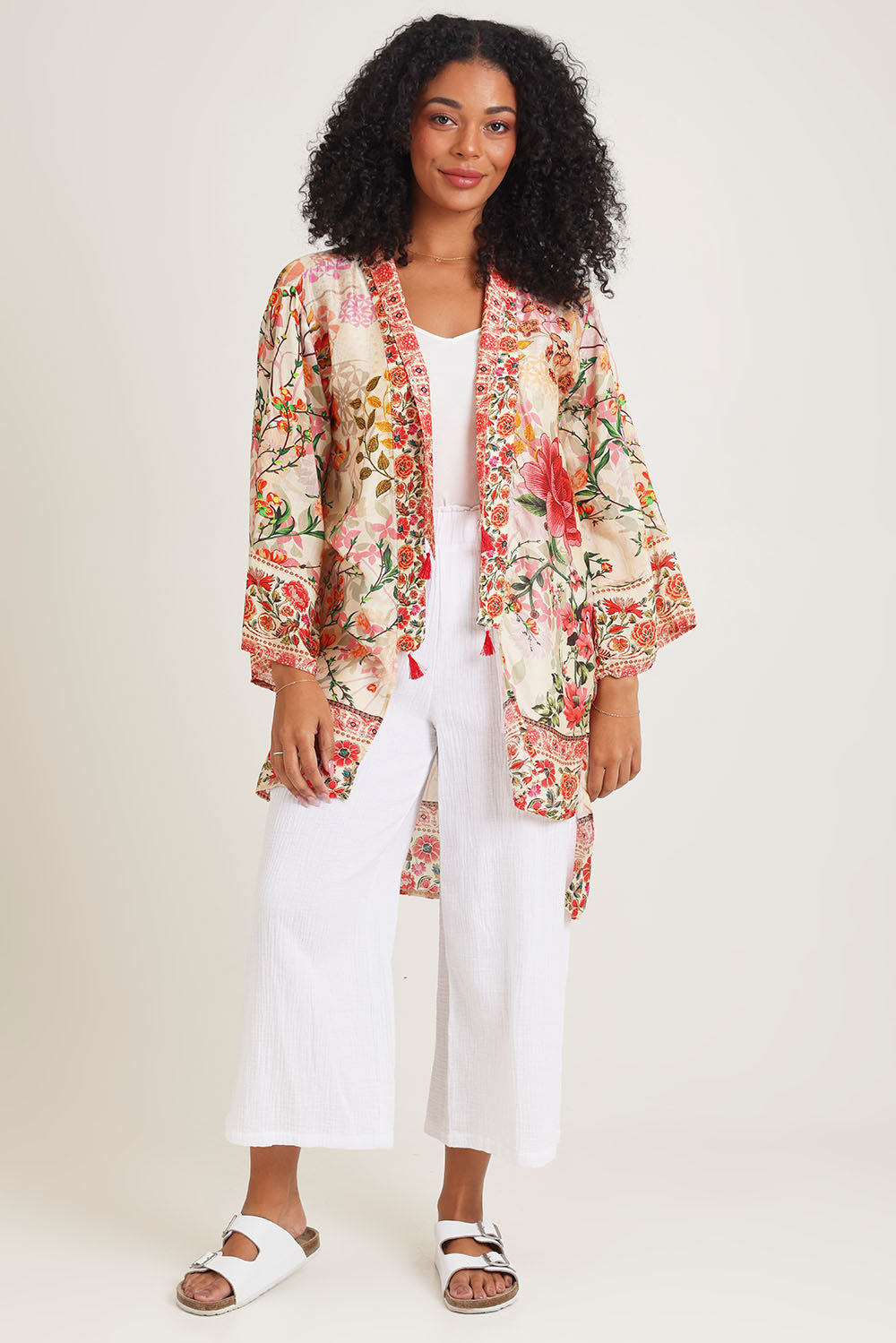 Model Ziara wearing the Rouge Bloom Kimono in colour Rouge, from the front, showing the whole outfit