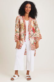 Model Ziara wearing the Rouge Bloom Kimono in colour Rouge, from the front, showing the whole outfit
