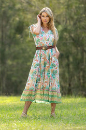 A model wearing the Mona Bluebell Cotton Dress in colour Mona, from the front, showing the whole outfit
